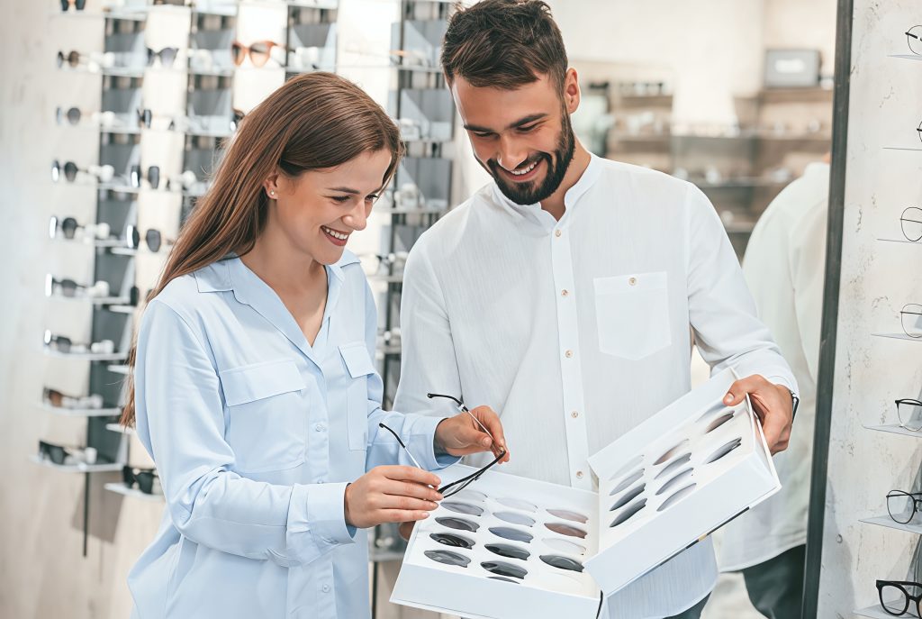 A man and a woman disussing over a design paper