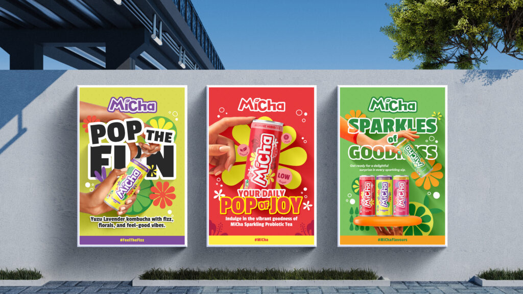 Three colorful promotional posters for Micha beverage cans displayed side by side on a wall, one yellow, one red, and the last one green.