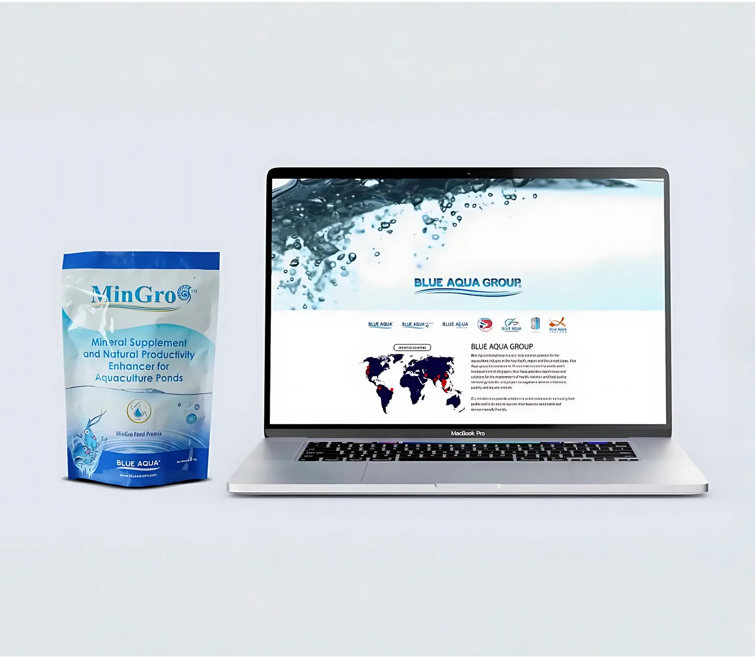 A stand-up pouch of MinGro mineral supplement for aquaculture ponds standing next to an open laptop displaying the Blue Aqua Group website against a light grey background.
